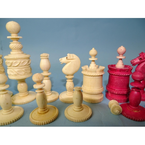 229 - A late-19th century carved  and stained bone chess set, one white pawn missing, small damages, in ma... 