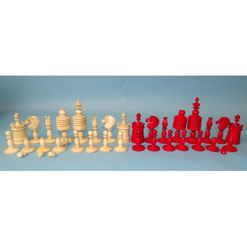 229 - A late-19th century carved  and stained bone chess set, one white pawn missing, small damages, in ma... 