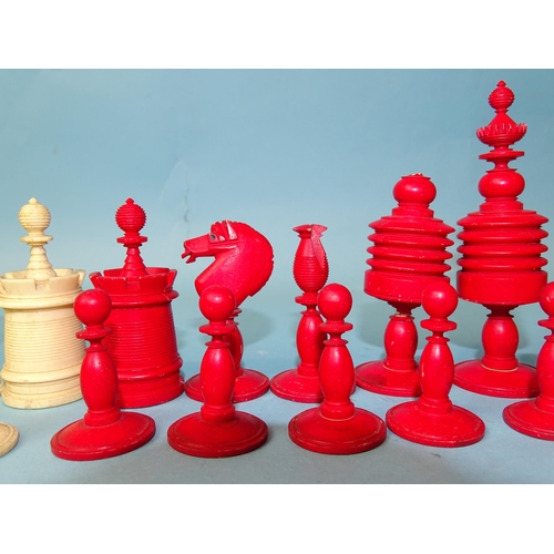 229 - A late-19th century carved  and stained bone chess set, one white pawn missing, small damages, in ma... 