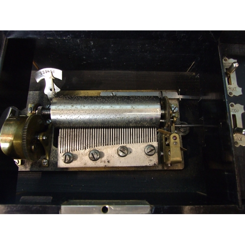 230 - A Swiss music box playing six airs, with 11cm comb and 12cm barrel, in grained rectangular case, 33c... 