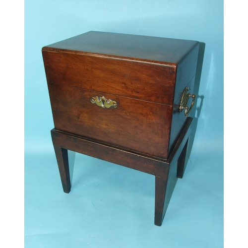 232 - A 19th century mahogany decanter box, the hinged lid revealing six compartments, with later brass ca... 