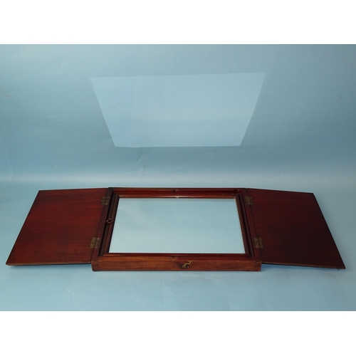 234 - An early-19th century mahogany travelling mirror, the rectangular folding case revealing a moulded f... 