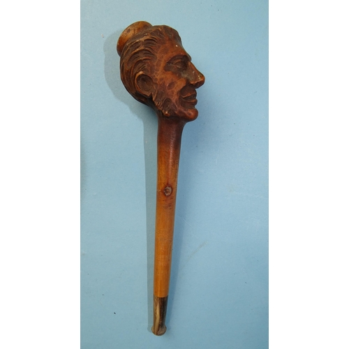 238 - A late-19th/early-20th century carved wood pipe in the form of a whiskered male figure, 16cm long, f... 