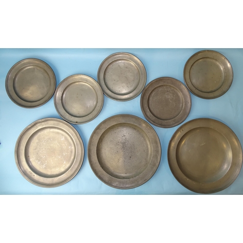 240 - Three large pewter plates with impressed touch marks, 34cm diameter, (one damaged) and five smaller ... 