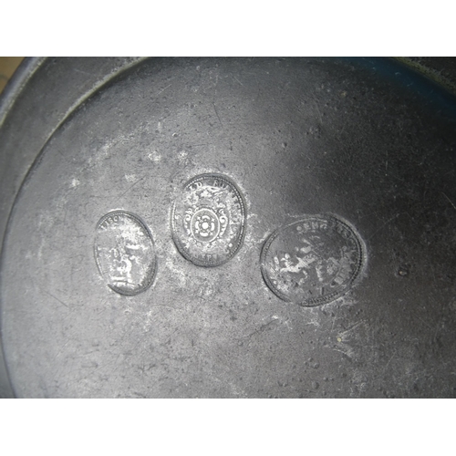 240 - Three large pewter plates with impressed touch marks, 34cm diameter, (one damaged) and five smaller ... 