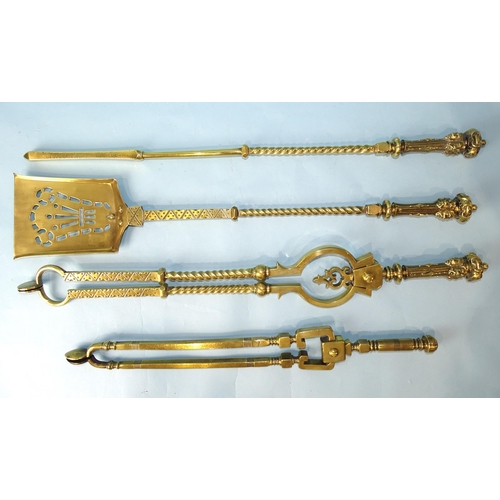 242 - A set of three heavy fire brasses, the handles with crown and masks decoration, twist columns, 72c, ... 