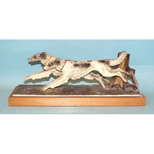 247 - An Austrian painted spelter table-top match strike in the form of two wolfhounds running, the match ... 