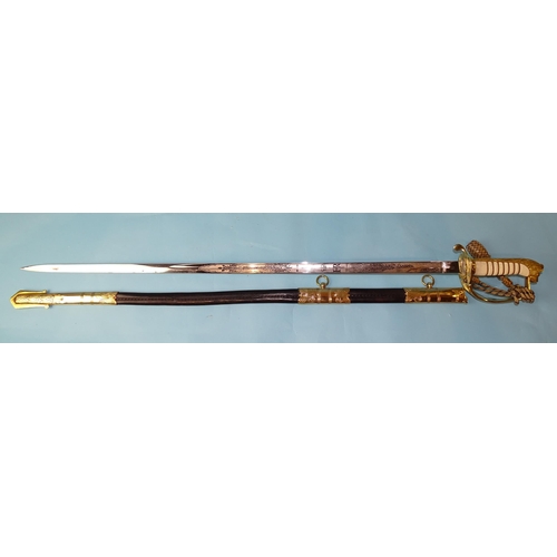 254 - An EIIR British Royal Navy officer's dress sword, the 31'' steel blade etched with crown over fouled... 