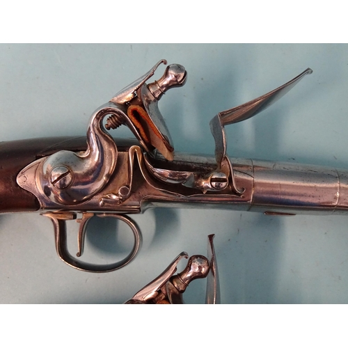 255 - A pair of 18th century flintlock cannon-barrelled pistols by Pounce, London, each with torn-off barr... 