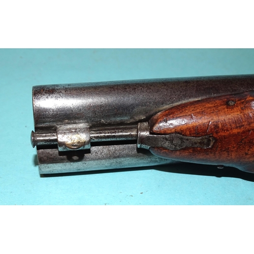 257 - A 19th century percussion double-barrelled pistol with 12cm barrels and walnut stock, 23cm overall a... 