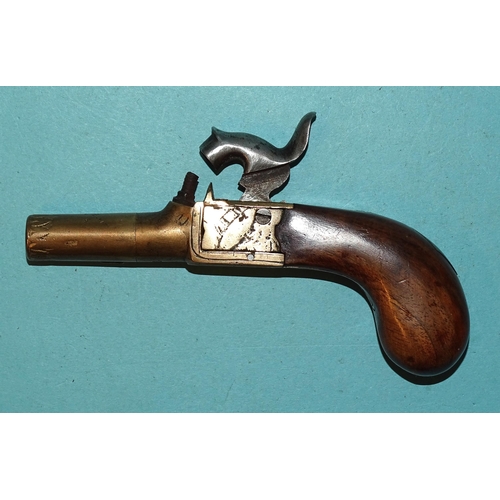 257 - A 19th century percussion double-barrelled pistol with 12cm barrels and walnut stock, 23cm overall a... 