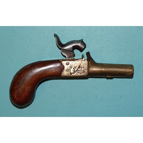 257 - A 19th century percussion double-barrelled pistol with 12cm barrels and walnut stock, 23cm overall a... 