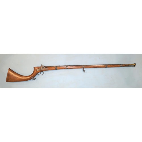 256 - A Middle-Eastern percussion jezail rifle with engraved lock, hammer and trigger guard, the 97cm barr... 