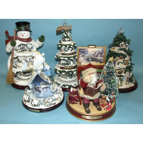 Thomas Kinkade for Bradford Exchange, five Christmas automaton decorations: 'Winter Wonderland', 'Wonderland Express', 'And To All A Good Night', 'Twas The Night Before Christmas', 'Glory To The New Born King' and other decorations.