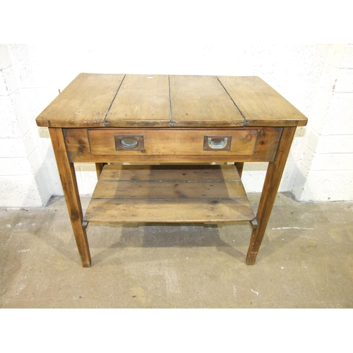10 - A rustic finish pine kitchen/side table having a single drawer and pot board, on square tapered legs... 