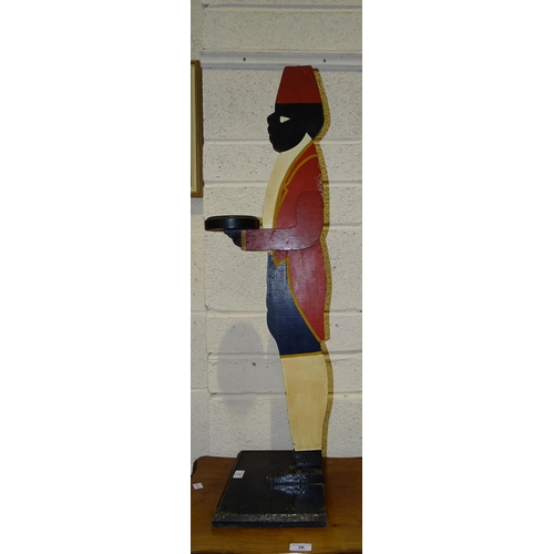 17 - A painted wood dumb waiter wearing a fez, 93cm high.