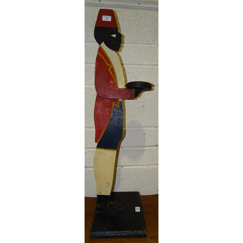 17 - A painted wood dumb waiter wearing a fez, 93cm high.