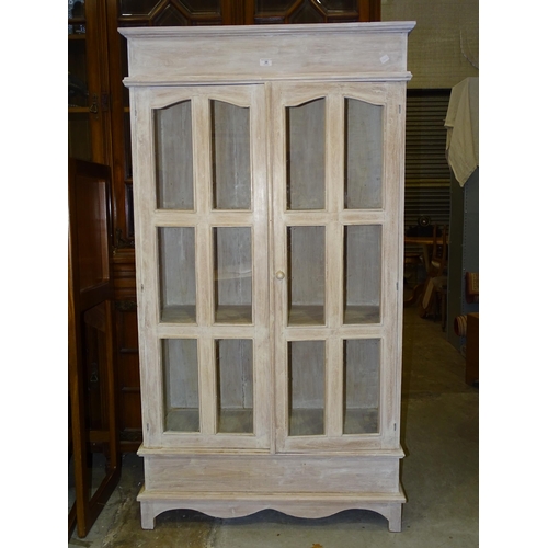 30 - A painted hardwood two-door glazed cupboard,  93cm wide, 172cm high, and a modern painted beech... 