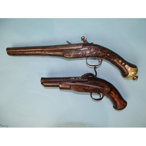 777 - A Turkish flintlock duelling pistol and a converted miquelet belt pistol, the 13.5cm two-stage barre... 