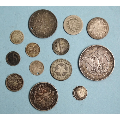 341 - A USA 1890 Morgan silver dollar, New Orleans Mint, a 1918 half-dollar and other silver world coinage... 