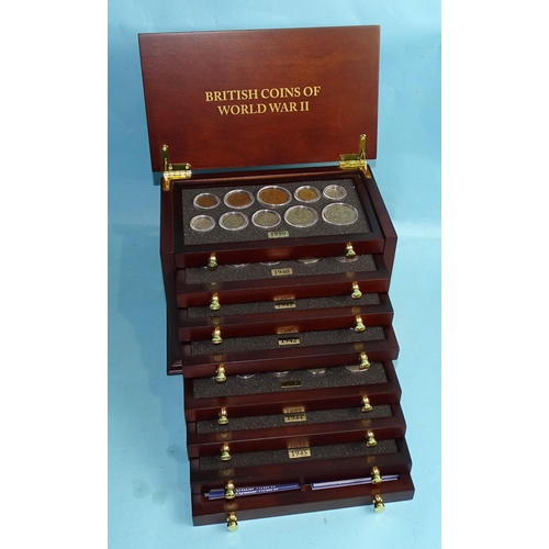 344 - The Danbury Mint 'British Coins of World War II', contained in an eight-drawer display chest, with c... 