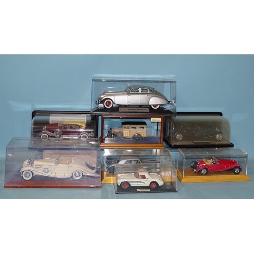 654 - Franklin Mint, 193 Duesenberg J in case, three other Franklin Mint diecasts and four other diecast c... 