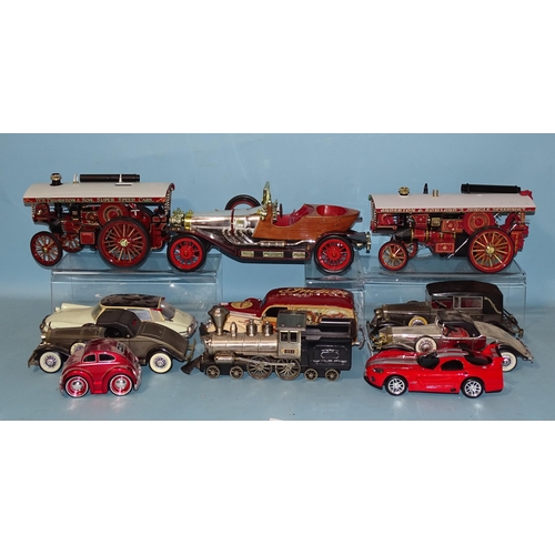 671 - Two Chinese-made models of fairground traction engines, a tinplate battery-driven American-style loc... 