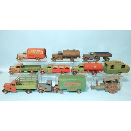 675 - Eight Minic commercial trucks, one steamroller, (roller missing) and a caravan, (all in poor conditi... 