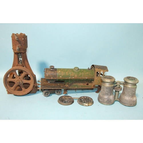 676 - A single-cylinder cast metal steam engine, an O gauge tinplate locomotive in very poor condition and... 