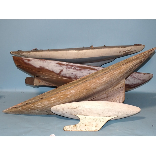 678 - Four pond yacht hulls, 91cm, 90cm (very damaged), 93cm and 47cm, (all in need of restoration), (4).... 