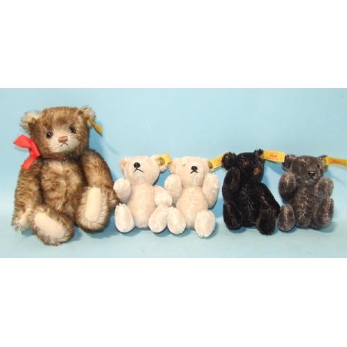 689 - Four Steiff 10cm miniature teddy bears: cream (x2), black and grey, and one 16cm teddy bear, all wit... 