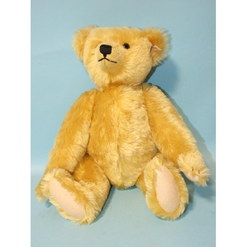 695 - A modern Steiff golden plush teddy bear with ear tag, 42cm, (no box).