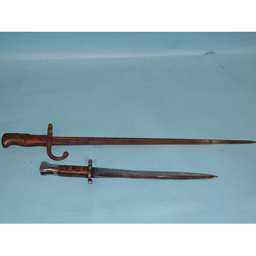 706 - A Belgian 1876 pattern sword bayonet with bronze and iron fittings and wood grips, the single-edge 5... 