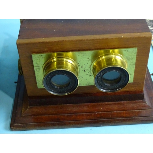 727 - A Smith Beck & Beck stereoscope, the mahogany lens mount panel replaced, in fitted box with ten ... 