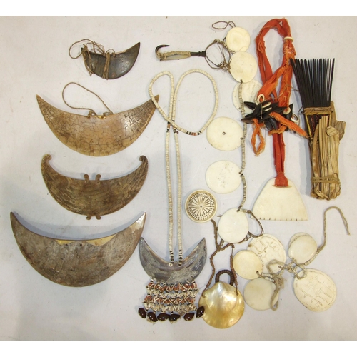 739 - A collection of Oceanic items: a turtle fish hook, a comb, marine ivory necklaces and pendants.... 