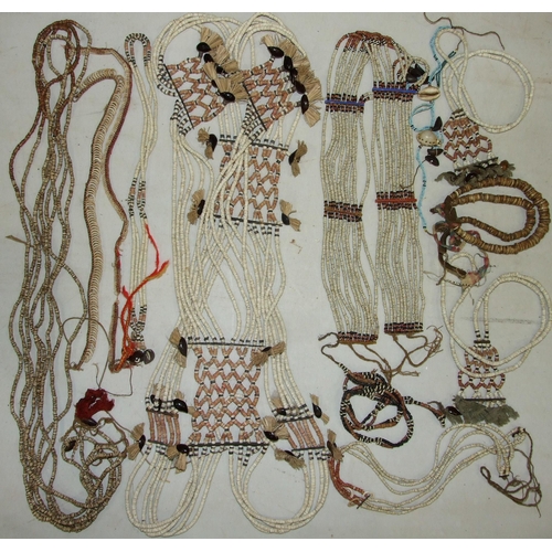 741 - A collection of Oceanic bead and shell-work belts, necklaces and bangles.