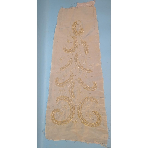 746 - A silk taffeta skirt panel of tapered form, embroidered with gold bugle beads and simulated pearls, ... 