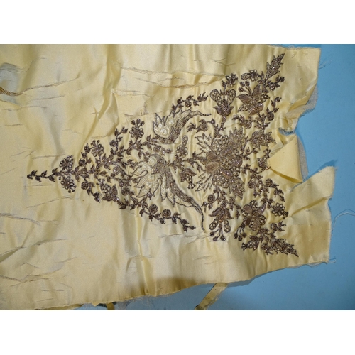 746 - A silk taffeta skirt panel of tapered form, embroidered with gold bugle beads and simulated pearls, ... 