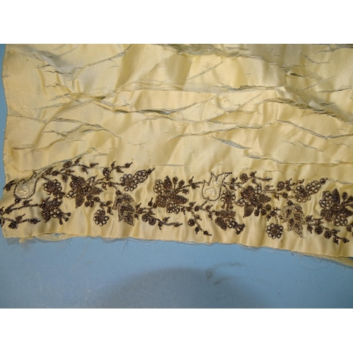 746 - A silk taffeta skirt panel of tapered form, embroidered with gold bugle beads and simulated pearls, ... 