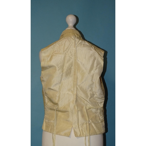 748 - A Victorian gentleman's ivory silk waistcoat, the revers and front embroidered in cream silk with fl... 