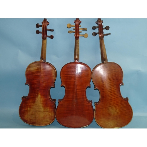 760 - A full-size violin labelled Antonius Stradivarius, with two-piece back and replacement tuning pegs, ... 