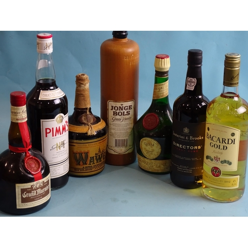 763 - A mixed lot: Jonge Bols Green Fenever 1L in stone bottle, Grand Marnier 70cl, Bacardi Gold 1L, Bénéd... 