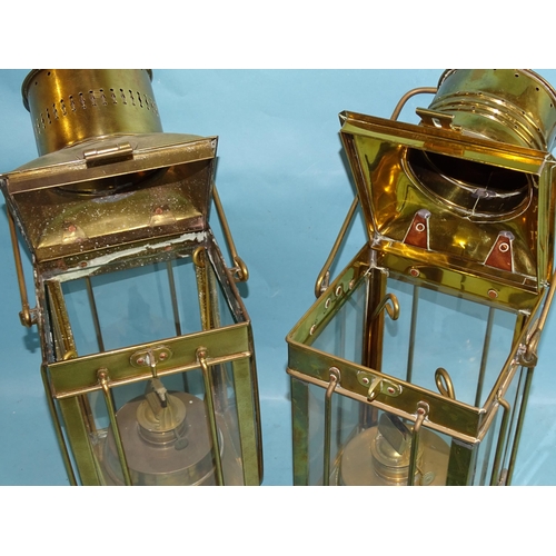 773 - Two vintage brass 20th century oil lamps with hinged tops, four glazed side panels and carrying hand... 