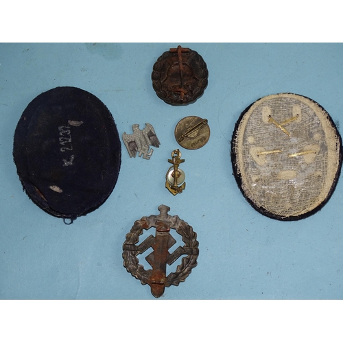 788 - A German SA sports badge (pin lacking), a German wound badge, a WWII German Kriegsmarine Engineer ar... 