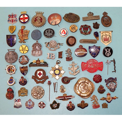 797 - A silver ARP badge and various other enamel and plastic badges, (approximately 50).