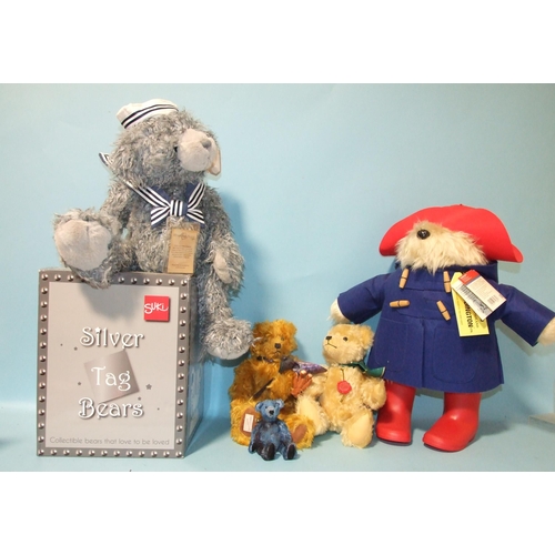 692 - A Rainbow Designs Paddington Bear, a boxed silver tag teddy bear and three others by Hermann Deans R... 