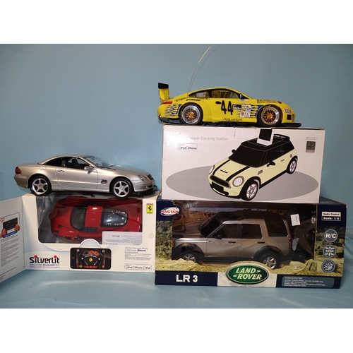 672 - A Silverlit Interactive Bluetooth remote control model Ferrari, a remote-controlled Land Rover LR3, ... 