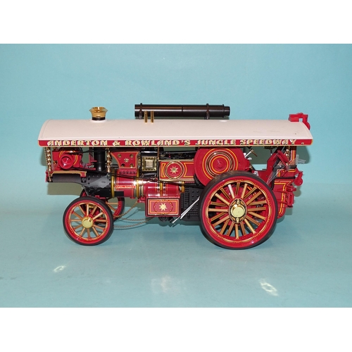 671 - Two Chinese-made models of fairground traction engines, a tinplate battery-driven American-style loc... 