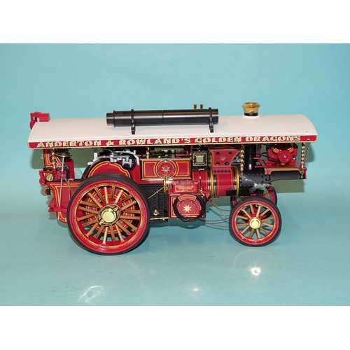 671 - Two Chinese-made models of fairground traction engines, a tinplate battery-driven American-style loc... 