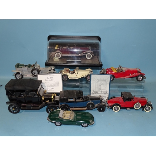 74 - Franklin Mint, a 1930 Duesenberg J Derham Tourster in display case and seven other Franklin Mint die... 